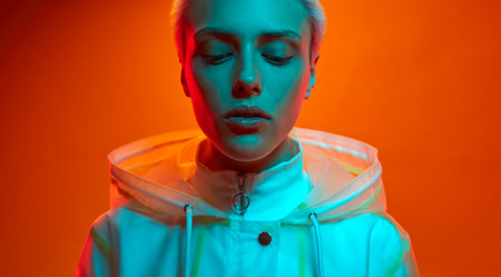 Calm futuristic model under neon illumination