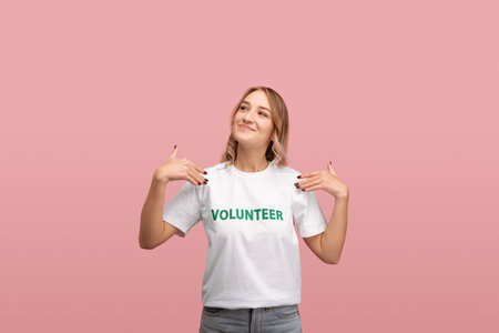 Proud woman showing volunteer t shirt