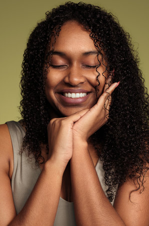 Cheerful black woman with curly hair