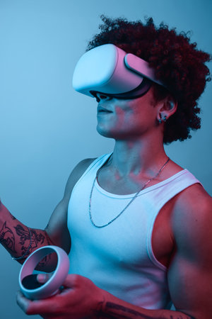 Black man playing videogame with VR headsetの写真素材