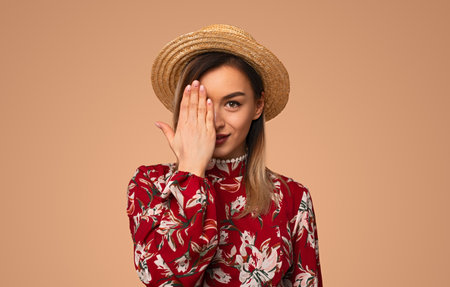 Elegant model covering half of faceの写真素材