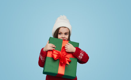 Cute girl with gift boxの写真素材