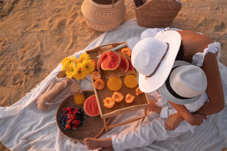 Mother And Son Enjoying A Summer Picnic On The Beachの写真素材