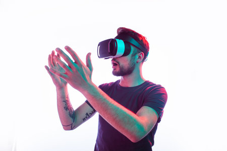 Man Immersed in Virtual Reality Experience Using VR Headset with Hand Interaction