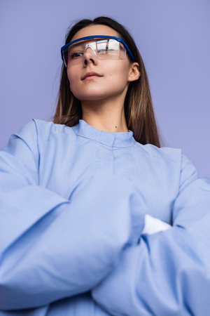 Confident Individual in Protective Eyewear Against a Minimalist Backgroundの写真素材