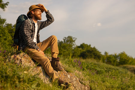 Traveler Resting Outdoors in a Scenic Nature Landscapeの写真素材