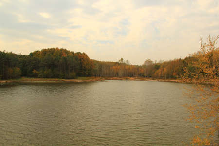 Autumn lake and woodsの写真素材
