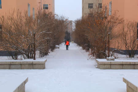 man walking alone at winterの写真素材