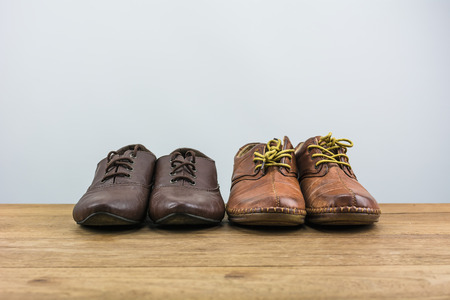 Shoes men active in daily life./ Shoes on the wooden floor and white background.の写真素材