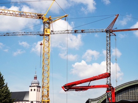 Construction crane against blue sky Subway construction site in Cologne Cologne, Germany 2014 between Cologne Cathedral and the main railway stationのeditorial素材