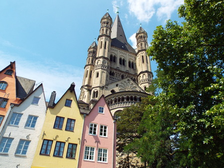 Church Gross St. Martin behind colorful town houses, Cologne, Germany 2014のeditorial素材