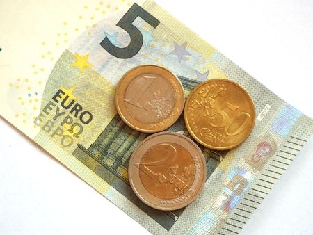 Minimum wage 8.50:  The German minimum wage as 5 euro note and coins.