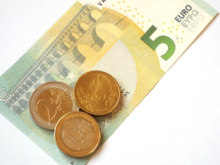 Minimum wage 8.50:  The German minimum wage as 5 euro note and coins.の写真素材