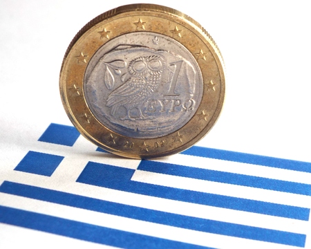 Greece crisis - A Greek Euro with the owl and the Greek flag.の写真素材