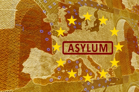 Asylum in Europe -On the map of Europe is the lettering ASYLUM. Surrounded by the European Circle of Stars.の写真素材