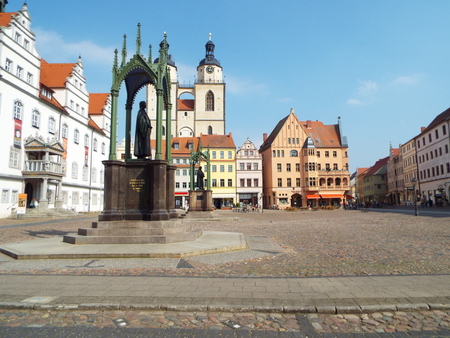 Market Place before the City Council with the monuments of Luther and Melanchthon, Wittenberg, Germany 04.12.2016 At the door of the Castle Church in Wittenberg reformer Martin Luther nailed his 95 theses. By Luther and Melanchthon, the Wittenberg wurde tのeditorial素材