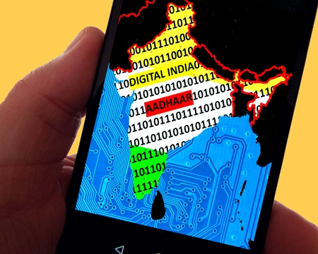 Digital India â  "Aadhaar: In the display of a smartphone is visible the map of India in the national colors. Merged with the sequence of numbers 1 and 0 as symbols of digital data storage. Nestled the terms "Digital India" and "Aadhaar".の写真素材