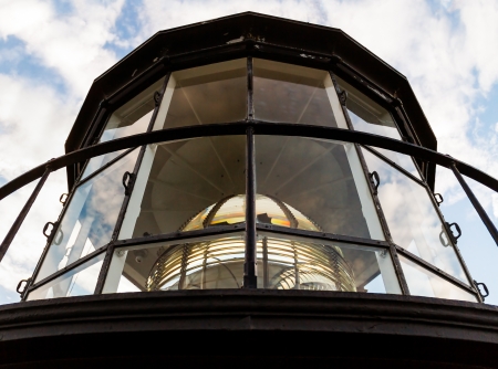 The Fresnel Lens in the Lamp Room of the Currituck Beach Lighthouse, in Carolla, North Carolina, is a complex collection of prism glass の写真素材