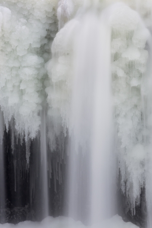 Intricate ice formations with silky smooth flowing whitewater at Indianaの写真素材