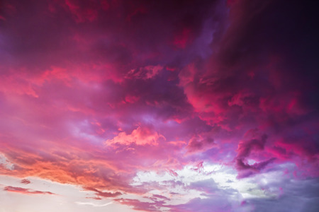 A dramatic and colorful cloudy sunset sky is photographed over Indiana.の写真素材