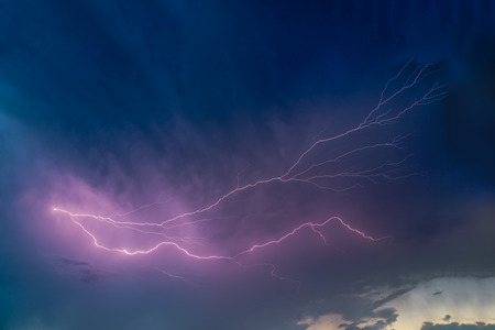 Lightning arcs across a stormy Midwestern sky in Indiana.の写真素材