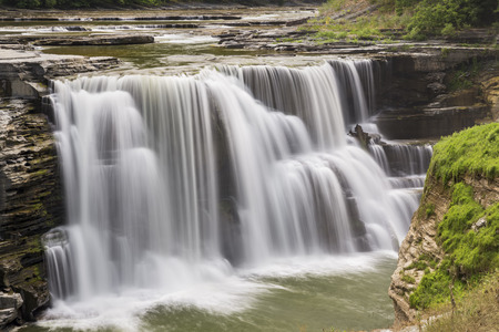 The Genesee River pours over Lower Falls, a waterfall in New York's Letchworth State Park.の写真素材