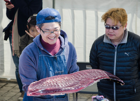 Osaka Japan March 23 2014  event in fish market show how to cut Tuna  identified man holding Raw...