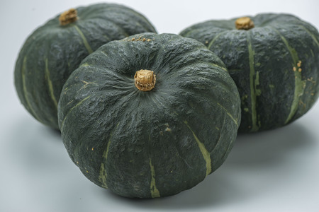 Harvested fresh pumpkin isolated on whiteの写真素材