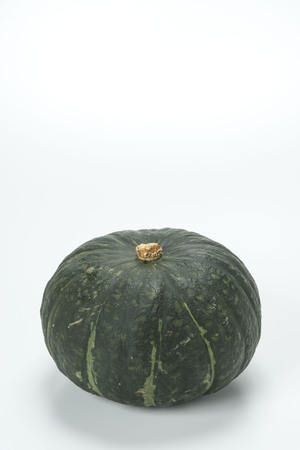 Harvested fresh pumpkin isolated on whiteの写真素材