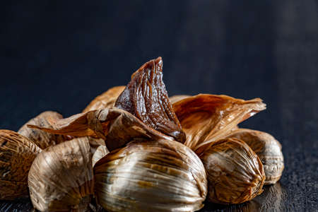 The black garlic is finished by cooking fresh and delicious garlic.の写真素材