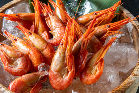 boiled shrimps on ice in a basket on the table.Japanese fresh and delicious shrimp.の写真素材