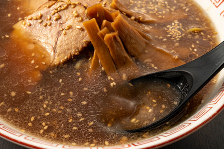soup simmered in soy sauce with pork, close upの写真素材