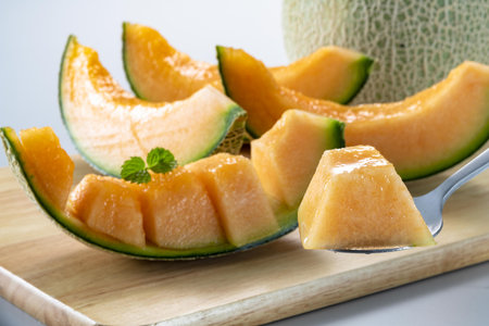Melon with slices and mint leavesの写真素材