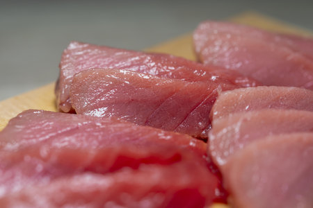 Raw fresh tuna sashimi on a cutting board. Selective focus.の写真素材