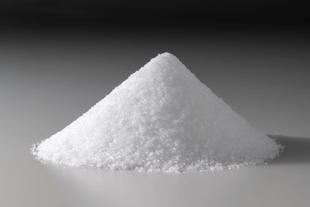 sugar pile on a gray background with copy space for text.の写真素材