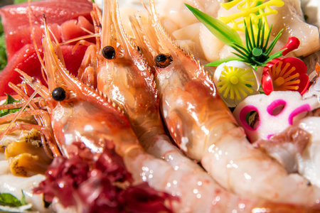 Sashimi japanese food style. Close up of fresh shrimps, prawns, squidpus and mussels.の写真素材