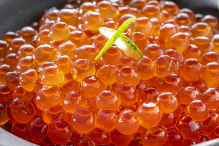 Salmon caviar in a bowl, close-up, macroの写真素材