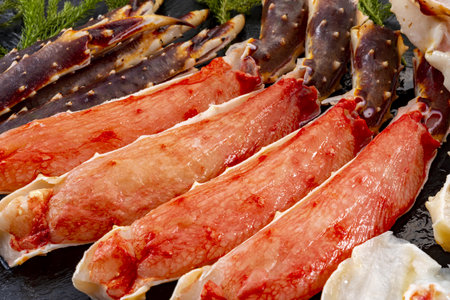 Seafood on a black stone plate. Close-up.の写真素材