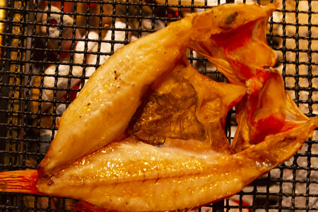 Fried fish on the grill in the restaurant. Close-upの写真素材