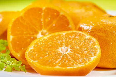Close up of a fresh tangerine fruit on a plate.の写真素材