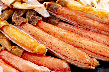 Crabclaws on black background. Seafood. Close up.の写真素材