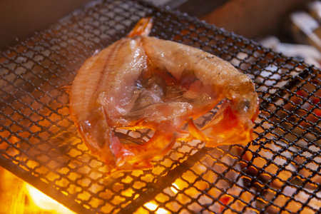 Grilled fish on the grill in the restaurant, close-upの写真素材