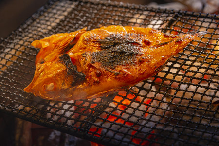 Grilled fish on the grill in the market. Close-up.の写真素材