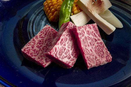 Japanese wagyu beef sashimi sliced on a blue plateの写真素材