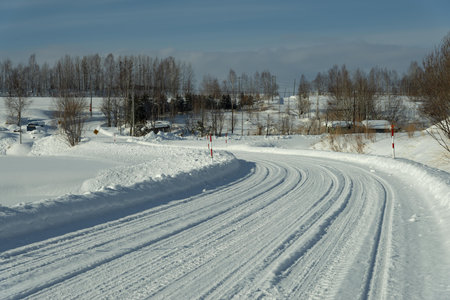 Winter road in the village. Russia, Siberia, Altai mountains.の写真素材