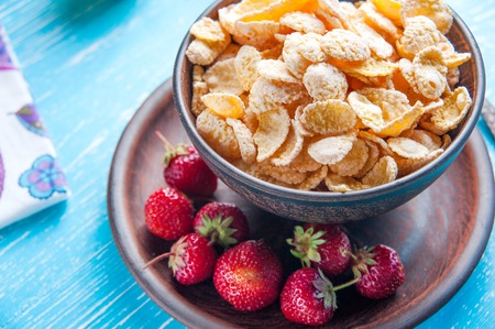 Healthy breakfast. Cornflakes and fresh strawberry closeupの写真素材