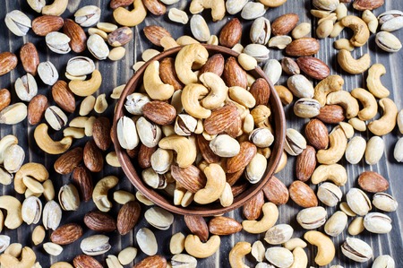 Mixed Nuts on wooden background. Healthy food and snack. Top view.の写真素材