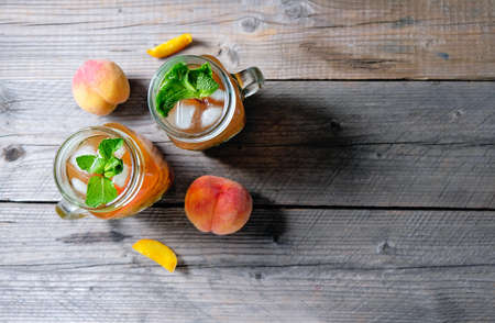 Fresh Homemade Peach Sweet Tea with Mintの写真素材