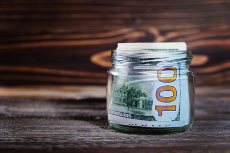 saving money in jar with American dollars , cashの写真素材