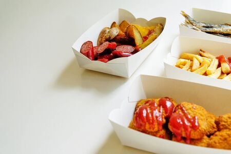 fast food and unhealthy eating concept - close up of fast food snacksの写真素材